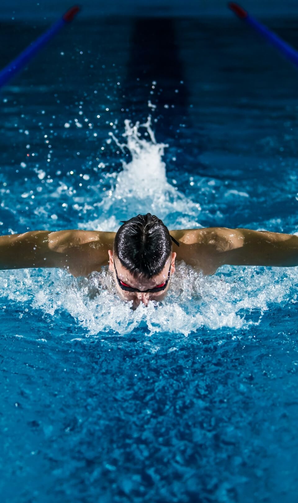 Swimmer diving into a pool